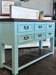 a blue table with drawers on it in a room