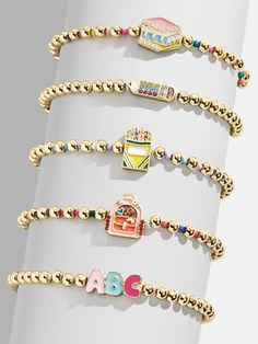 Ace your back to school style with the Hit The Books Kids' Pisa Bracelet Set. Each of the five bracelets is adorned with fun school supplies and themed pendants, like pencils, rulers, ABCs and more. Mix and match to create the cutest wrist stack, or share with friends to start the school year off with a smile. Please note: intended for children 3+ Fun School Supplies, Smile Please, Wrist Stack, Wrist Stacks, Fun School, Cool School Supplies, Kids Bracelets, School Style, Kids Jewelry