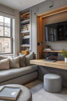 a living room filled with furniture and a flat screen tv mounted to the side of a wall