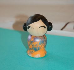 a small figurine sitting on top of a table