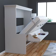 a bed with a slide on top of it in a room