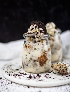 cookies and cream in a glass jar on a plate