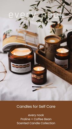 candles for self care are displayed on a table