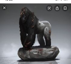 a statue of a gorilla standing on top of a rock with blood all over it