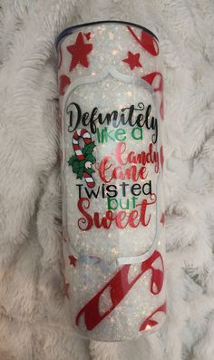 this tumble is decorated with red, white and green glitters on it's side