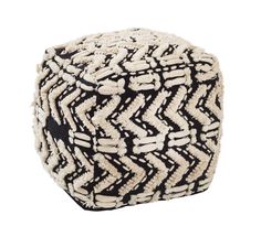 a black and white cube with an intricate pattern on it's sides, sitting in front of a white background