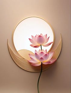 a pink flower sitting on top of a wooden table next to a round wall mirror