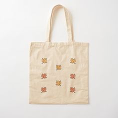 a tote bag with autumn leaves on it