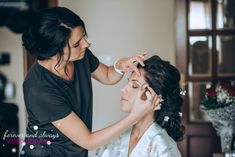 a woman getting her hair done by another woman