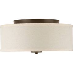 a light fixture with a white shade on it