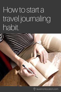 a woman sitting at a table with a notebook and pen in her hand, reading how to start a travel journal habit