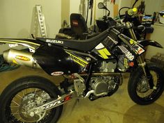 a dirt bike parked inside of a garage