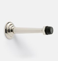 an image of a door handle with black knobs on the outside and chrome finish