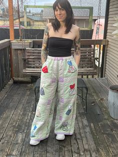 a woman standing on top of a wooden deck