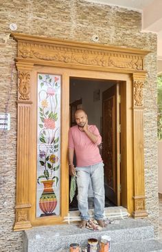 a man standing in the doorway of a building