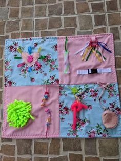 a pink and blue mat with various items on it