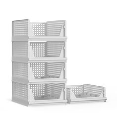 three white baskets stacked on top of each other in front of a white background with the bottom half open