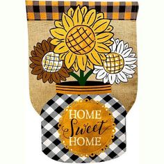 a burlap bag with sunflowers in a mason jar and the words home sweet home on it