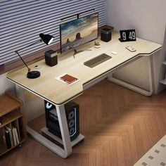 a computer desk with a monitor and keyboard on it