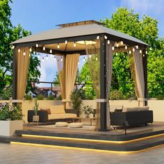 a gazebo with curtains and lights on it in the middle of a patio area