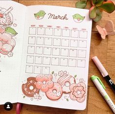 an open planner with doughnuts and donuts on the page next to markers