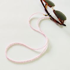 Pink beaded glasses chain, Sunglasses pink cord, Eyewear holder, Sunglasses necklace, Pink glasses holder, Sunglasses strap, Eyeglasses cord Beautiful fashion trend sunglasses beaded string This sunglass strap is lightweight, comfortable to wear and secures your sunglasses on your neck. Fashion trend accessory for the summer! Total length is 70cm / 27.7 inches. Beautifully packaged and ready for gift giving. JEWELRY CARE: Please take care of your jewelry do not wear in the shower, swimming pool, Trendy Adjustable Pink Beaded Necklaces, Trendy Pink Adjustable Beaded Necklaces, Trendy Pink Adjustable Beaded Necklace, Handmade Adjustable Pink Glasses Chains, Adjustable Pink Beaded Glasses Chain, Adjustable Pink Glasses Chains As Gift, Handmade Pink Glasses Chains For Summer, Adjustable Pink Necklaces For Fashion Accessory, Pink Glass Glasses Chains For Summer