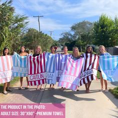 a group of women holding up towels in the shape of striped beach towels that read, the product in the photo adult size - 30'xoxo's premium towel