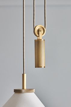 a lamp that is on top of a light fixture with a cord attached to it