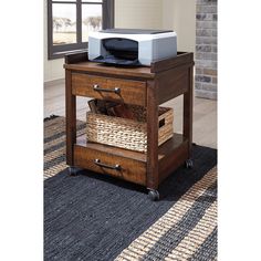 a printer is sitting on top of a small table with baskets underneath it in front of a brick wall