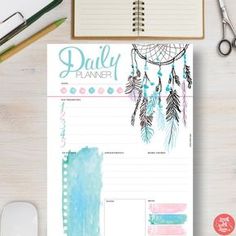 the daily planner is open on top of a desk