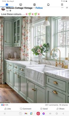 a kitchen with green cabinets and white marble counter tops is featured in the instagram