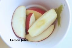 an apple sliced into slices in a white bowl with the words lemon juice on it