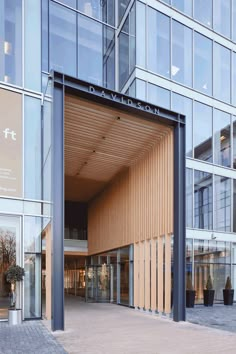 the entrance to an office building with large windows