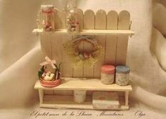 a dollhouse shelf with various items on it