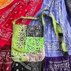 many different colored bags are lined up together