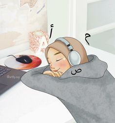 a person with headphones sleeping next to a laptop on a desk in front of a mouse