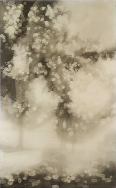 an abstract photo of trees and clouds in sepia tone with black and white filter