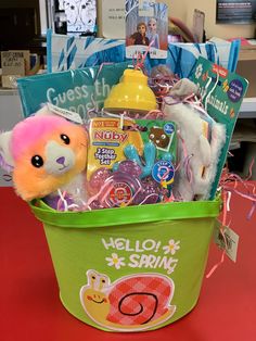 a basket filled with lots of toys on top of a table