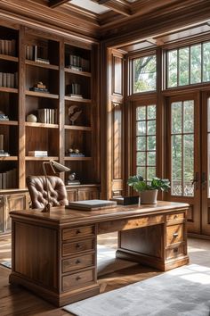 a large wooden desk sitting inside of a room next to a book shelf filled with books