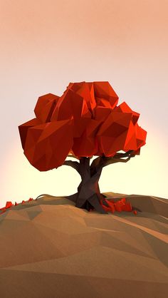 a red tree sitting on top of a sandy hill