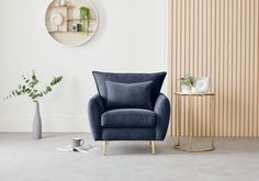 modern charcoal navy blue velvet armchair with winged back cushion corners on gold tapered metal legs Gold Sofa, Contemporary Armchair, Gold Legs