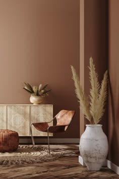 a living room with brown walls and furniture in the corner, including two chairs and a vase