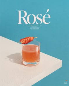 a magazine cover with a drink on the table and a piece of food sticking out of it