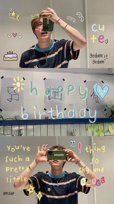 a young man holding up a camera to take a selfie in front of a happy birthday sign