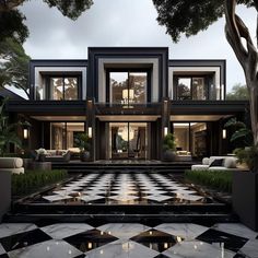 a large black and white checkerboard floor in front of a house with lots of windows