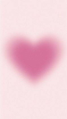 a heart shaped object on a pink background