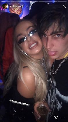 two people posing for a photo at a party