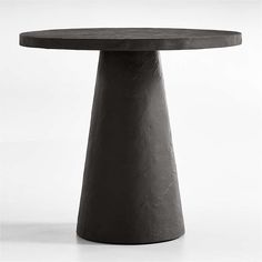 a round table with a black top on a white background