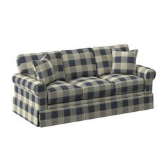 a blue and white checkered couch with four pillows on the back, sitting against a white background