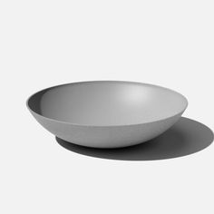 a white bowl sitting on top of a table